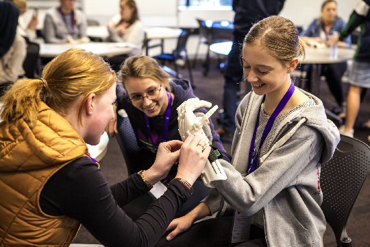 students with prosthetic hand