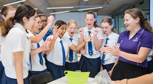 Young women excited about engineering experiment