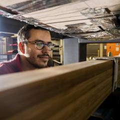 UQ PhD candidate Mateo Gutierrez tests engineered bamboo beams in the UQ Fire laboratory.