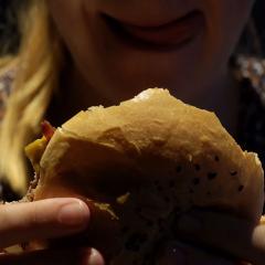 women eating burger