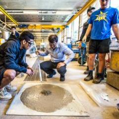 Researcher and lecturer Dr Johnny Ho with undergraduate students in the concrete laboratory at UQ.