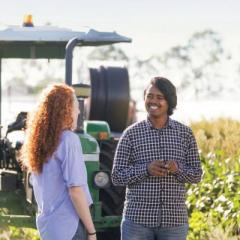 people talking on farm