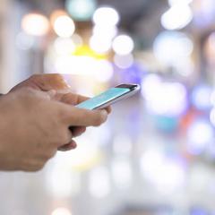 hands holding mobile phone