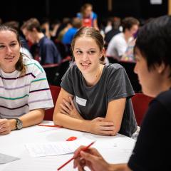image of students sitting at a table