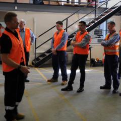 workmen at stand up meeting