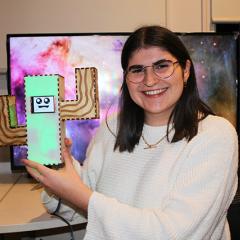 The final prototype of Lucy Davidson’s interactive device ‘Energy Saving Emily’ will look like a cactus and will sing R.E.M’s ‘Everybody Hurts’ if ignored. 