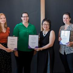 Photo of staff receiving awards from Vicki Chen, Executive Dean