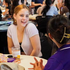 Female engineering students smiling during welcome event at The University of Queensland